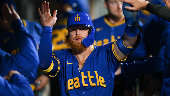 Seattle Mariners first baseman Justin Turner celebrates after scoring a run during a game against the Texas Rangers on Saturday at T-Mobile Park. Seattle Mariners first baseman Justin Turner celebrates after scoring a run during a game against the Texas Rangers on Saturday at T-Mobile Park.