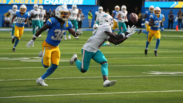 Miami Dolphins wide receiver Tyreek Hill (10) catches a 47-yard pass against Los Angeles Chargers cornerback Ja'Sir Taylor (36) in the fourth quarter at SoFi Stadium in the 2023 opener.
