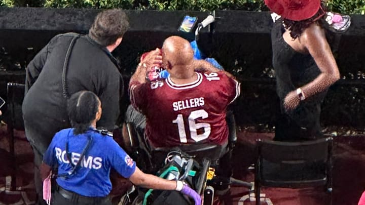A fan attending Saturday night's college football game was beaned in the shoulder during a celebration gone wrong.