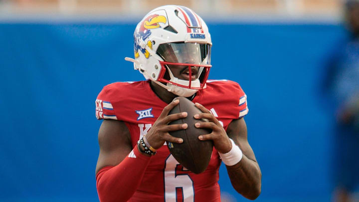 Aug 29, 2025; Lawrence, Kansas, USA; Kansas Jayhawks quarterback Jalon Daniels (6) looks to pass during the first half against the Wagner Seahawks at David Booth Kansas Memorial Stadium. Mandatory Credit: William Purnell-Imagn Images Aug 29, 2025; Lawrence, Kansas, USA; Kansas Jayhawks quarterback Jalon Daniels (6) looks to pass during the first half against the Wagner Seahawks at David Booth Kansas Memorial Stadium. Mandatory Credit: William Purnell-Imagn Images