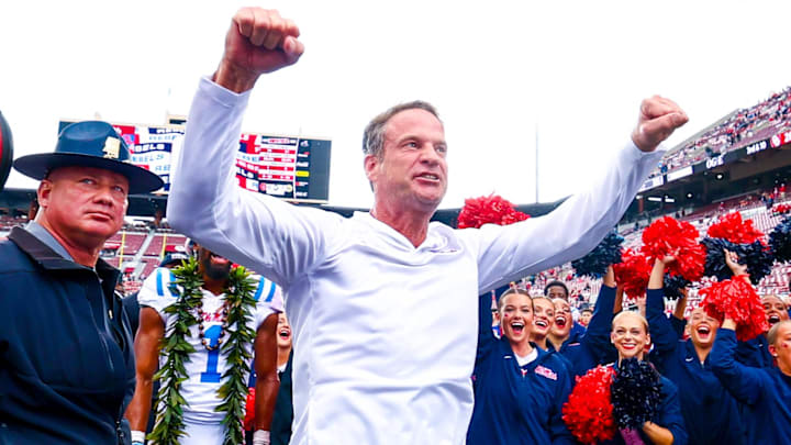 Oct 25, 2025; Norman, Oklahoma, USA; Ole Miss Rebels head coach Lane Kiffin celebrates with fans after the game against the Oklahoma Sooners at Gaylord Family-Oklahoma Memorial Stadium. Mandatory Credit: Kevin Jairaj-Imagn Images Oct 25, 2025; Norman, Oklahoma, USA; Ole Miss Rebels head coach Lane Kiffin celebrates with fans after the game against the Oklahoma Sooners at Gaylord Family-Oklahoma Memorial Stadium. Mandatory Credit: Kevin Jairaj-Imagn Images