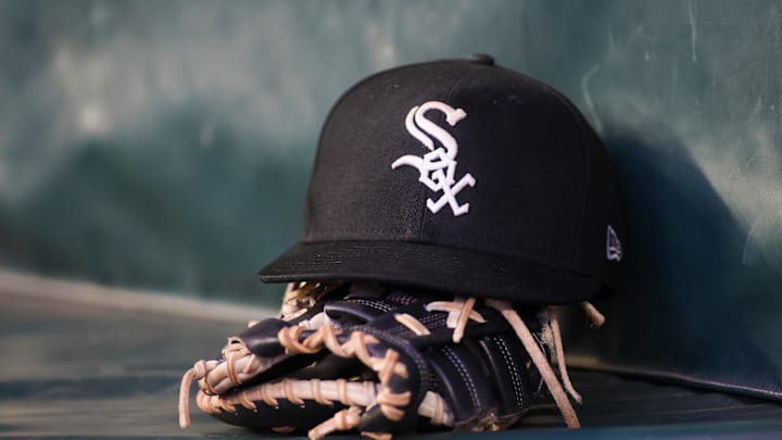 Jul 14, 2023; Atlanta, Georgia, USA; A detailed view of a Chicago White Sox hat and glove in the dugout against the Atlanta Braves in the fourth inning at Truist Park. Mandatory Credit: Brett Davis-Imagn Images