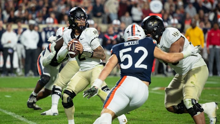 Robby Ashford (2) attempting a pass against the Virginia Cavaliers, Nov. 8, 2025.