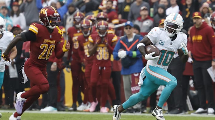 Dec 3, 2023; Landover, Maryland, USA; Miami Dolphins wide receiver Tyreek Hill (10) runs