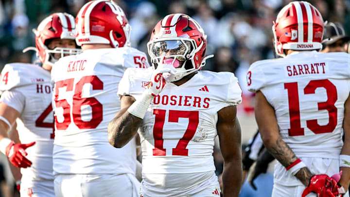 Indiana's Ty Son Lawton silences the crowd after a touchdown run against Michigan State during the second quarter on Saturday, Nov. 2, 2024, at Spartan Stadium in East Lansing.