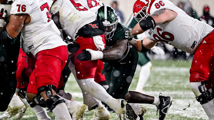 Michigan State's Quindarius Dunnigan, right tackles Rutgers' Kyle Monangai during the third quarter on Saturday, Nov. 30, 2024, at Spartan Stadium in East Lansing. Michigan State's Quindarius Dunnigan, right tackles Rutgers' Kyle Monangai during the third quarter on Saturday, Nov. 30, 2024, at Spartan Stadium in East Lansing.