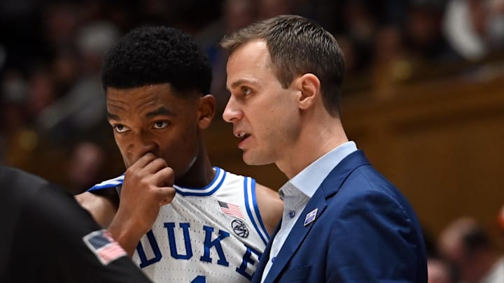 Duke basketball guard Caleb Foster and head coach Jon Scheyer Duke basketball guard Caleb Foster and head coach Jon Scheyer