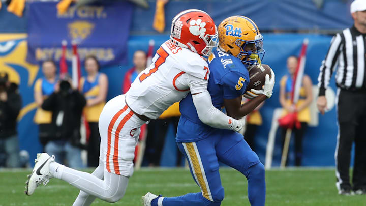 Nov 16, 2024; Pittsburgh, Pennsylvania, USA; Pittsburgh Panthers wide receiver Raphael Williams Jr. (5) runs after a  catch against Clemson Tigers safety Khalil Barnes (7) during the second quarter at Acrisure Stadium. Mandatory Credit: Charles LeClaire-Imagn Images