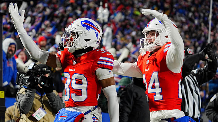Buffalo Bills CB Cam Lewis celebrates with S Cole Bishop after his interception against the Patriots.