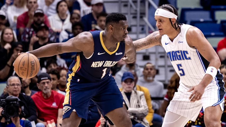 New Orleans Pelicans forward Zion Williamson (1) dribbles against Orlando Magic forward Paolo Banchero (5).