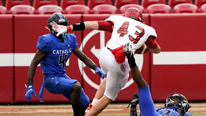 Fyffe's Brody Dalton (43) plants after making a catch and advances the ball forward. Fyffe High School defeated Montgomery Catholic 21-16 to win the AHSAA 3A State Championship on Dec. 3, 2020 at Bryant-Denny Stadium. [Photo/Hannah Saad]

Tus Al Fyffevsmontcatholic3achampionship 6499