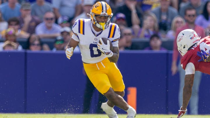 Nov 15, 2025; Baton Rouge, Louisiana, USA; LSU Tigers running back Ju'Juan Johnson (8) runs against the Arkansas Razorbacks during the first half at Tiger Stadium. Mandatory Credit: Stephen Lew-Imagn Images Nov 15, 2025; Baton Rouge, Louisiana, USA; LSU Tigers running back Ju'Juan Johnson (8) runs against the Arkansas Razorbacks during the first half at Tiger Stadium. Mandatory Credit: Stephen Lew-Imagn Images