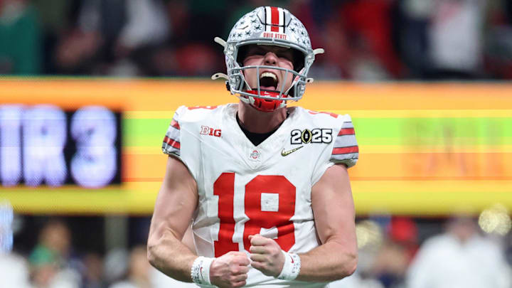 Jan 20, 2025" Ohio State Buckeyes quarterback Will Howard reacts after a play against the Notre Dame Fighting Irish during the CFP National Championship.