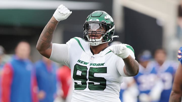 Nov 6, 2022; East Rutherford, New Jersey, USA; New York Jets defensive tackle Quinnen Williams (95) celebrates a defensive stop against the Buffalo Bills during the second half at MetLife Stadium. Mandatory Credit: Vincent Carchietta-Imagn Images
