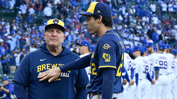 Oct 8, 2025; Chicago, Illinois, USA; Milwaukee Brewers designated hitter Christian Yelich (22) greets manager Pat Murphy (49) prior to game three of the NLDS round against the Chicago Cubs for the 2025 MLB playoffs at Wrigley Field. Mandatory Credit: Matt Marton-Imagn Images