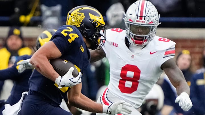 Ohio State Buckeyes linebacker Arvell Reese (8) pursues Michigan Wolverines running back Bryson Kuzdzal (24) during the NCAA football game at Michigan Stadium in Ann Arbor, Mich. on Nov. 29, 2025. Ohio State won 27-9.