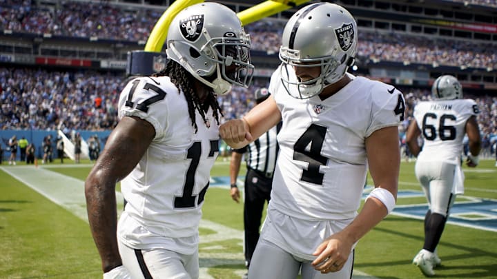 Sep 25, 2022; Raiders receiver Davante Adams (17) celebrates a touchdown against the Tennessee Titans with quarterback Derek Carr (4)