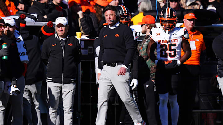 Nov 29, 2024; Boulder, Colorado, USA; Oklahoma State Cowboys head coach Mike Gundy walks the sidelines the second quarter against the Colorado Buffaloes at Folsom Field. Mandatory Credit: Ron Chenoy-Imagn Images Nov 29, 2024; Boulder, Colorado, USA; Oklahoma State Cowboys head coach Mike Gundy walks the sidelines the second quarter against the Colorado Buffaloes at Folsom Field. Mandatory Credit: Ron Chenoy-Imagn Images