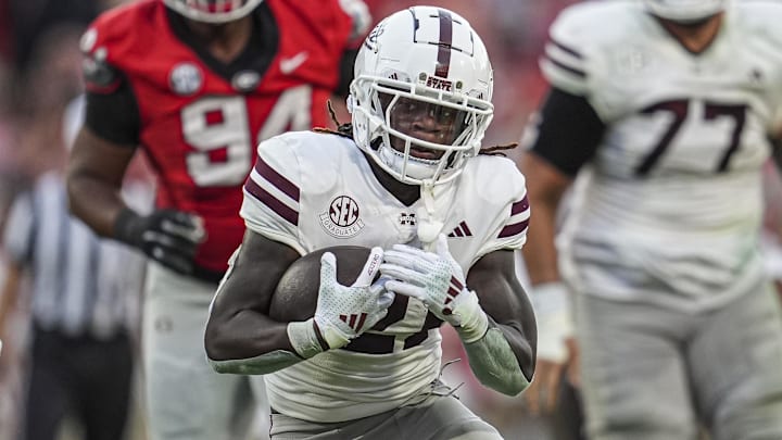 Mississippi State Bulldogs running back Davon Booth (21) runs the ball against the Georgia Bulldogs at Sanford Stadium.