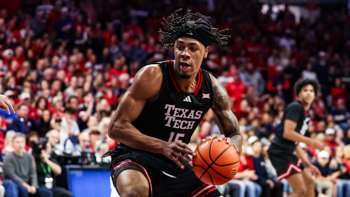 Feb 14, 2026; Tucson, Arizona, USA; Texas Tech Red Raiders forward JT Toppin (15) dribbles and dunks the ball during the first half of the game against the Arizona Wildcats at McKale Memorial Center. Mandatory Credit: Aryanna Frank-Imagn Images Feb 14, 2026; Tucson, Arizona, USA; Texas Tech Red Raiders forward JT Toppin (15) dribbles and dunks the ball during the first half of the game against the Arizona Wildcats at McKale Memorial Center. Mandatory Credit: Aryanna Frank-Imagn Images