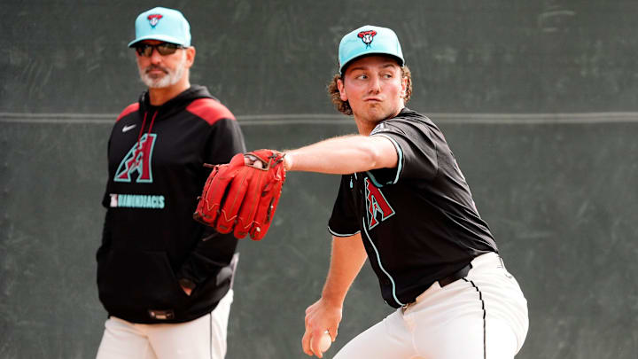 Arizona Diamondbacks manager Torey Lovullo watches pitcher Brandon Pfaadt during spring training workouts at Salt River Fields at Talking Stick on Feb. 14, 2025, in Scottsdale. Arizona Diamondbacks manager Torey Lovullo watches pitcher Brandon Pfaadt during spring training workouts at Salt River Fields at Talking Stick on Feb. 14, 2025, in Scottsdale.