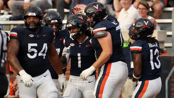 Sep 26, 2026; Charlottesville, Virginia, USA; Virginia Cavaliers wide receiver Rico Flores Jr. (1) celebrates with teammates after scoring a touchdown against the Delaware Blue Hens during the first half at Scott Stadium. Mandatory Credit: Geoff Burke-Imagn Images