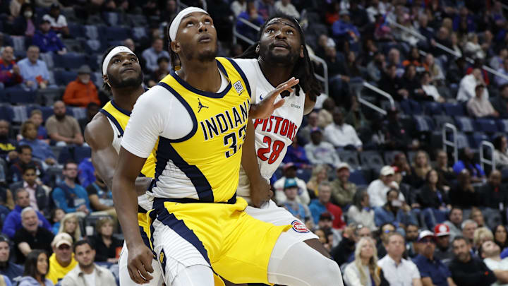 Oct 23, 2024; Detroit, Michigan, USA;  Indiana Pacers center Myles Turner (33) and Detroit Pistons center Isaiah Stewart (28) look for the rebound in the first half at Little Caesars Arena. Mandatory Credit: Rick Osentoski-Imagn Images
