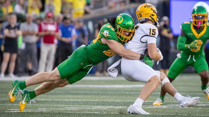 Oregon Ducks linebacker Bryce Boettcher brings down Idaho Vandals wide receiver Mark Hamper as the Oregon Ducks host the Idaho Vandals Saturday, Aug. 31, 2024 at Autzen Stadium in Eugene, Ore.