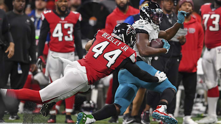 Jacksonville Jaguars running back Leonard Fournette (27) tackled by Atlanta Falcons linebacker Vic Beasley