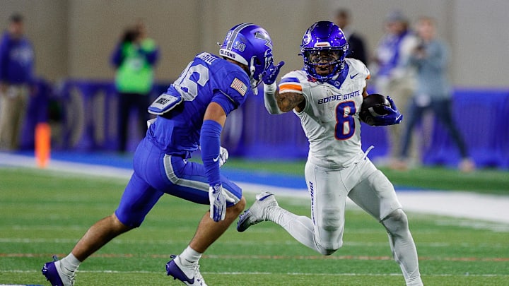 Sep 20, 2025; Colorado Springs, Colorado, USA; Boise State Broncos running back Malik Sherrod (8) runs the ball as Air Force Falcons defensive back Max Mustell (36) defends in the fourth quarter at Falcon Stadium.