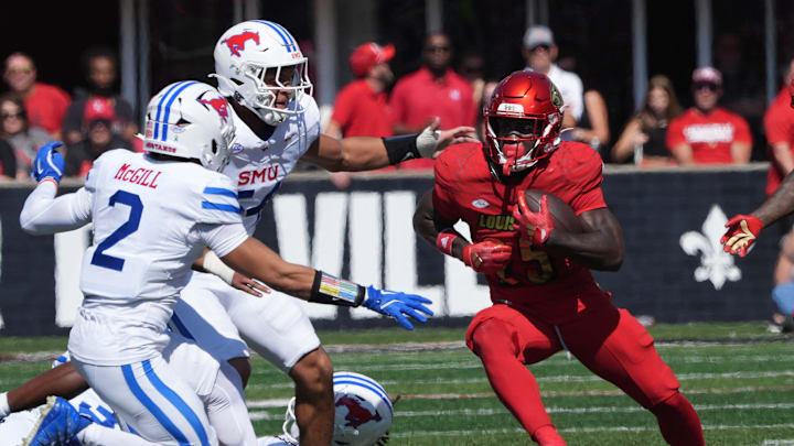 Louisville’s Issac Brown gets a first down against SMU this Saturday.
Oct. 5, 2024