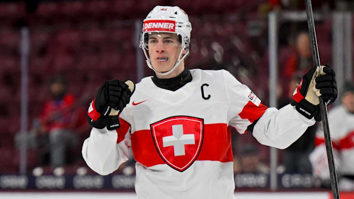 Jan 2, 2026; Minneapolis, Minnesota, USA; Switzerland defensemen Leon Muggli (41) celebrates his goal against Czechia during the first period in the quarterfinals of the 2026 IIHF World Junior Championship at 3M Arena. Mandatory Credit: Nick Wosika-Imagn Images
