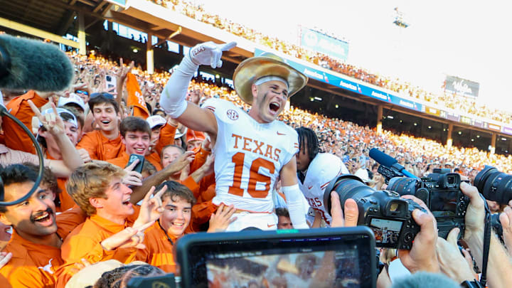 Oct 12, 2024; Dallas, Texas, USA;  Texas Longhorns defensive back Michael Taaffe (16) celebrates with fans after the game against the Oklahoma Sooners at the Cotton Bowl. Mandatory Credit: Kevin Jairaj-Imagn Images