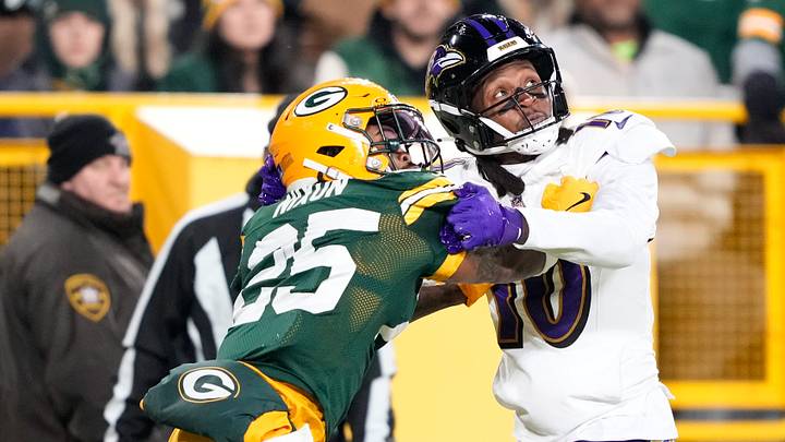 Dec 27, 2025; Green Bay, Wisconsin, USA; Baltimore Ravens wide receiver DeAndre Hopkins (10) watches a pass under coverage by Green Bay Packers cornerback Keisean Nixon (25) during the second quarter at Lambeau Field. Mandatory Credit: Kayla Wolf-Imagn Images Dec 27, 2025; Green Bay, Wisconsin, USA; Baltimore Ravens wide receiver DeAndre Hopkins (10) watches a pass under coverage by Green Bay Packers cornerback Keisean Nixon (25) during the second quarter at Lambeau Field. Mandatory Credit: Kayla Wolf-Imagn Images