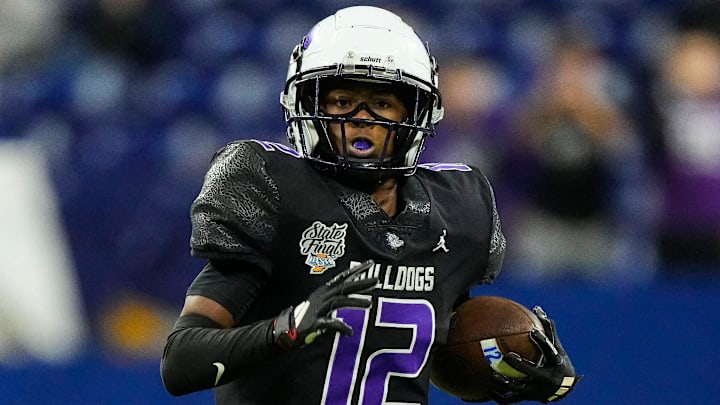 Brownsburg Bulldogs WRSB Branden Sharpe (12) rushes up the field Saturday, Nov. 29, 2025, during the IHSAA Class 6A state championship game at Lucas Oil Stadium in Indianapolis. Brownsburg Bulldogs WRSB Branden Sharpe (12) rushes up the field Saturday, Nov. 29, 2025, during the IHSAA Class 6A state championship game at Lucas Oil Stadium in Indianapolis.