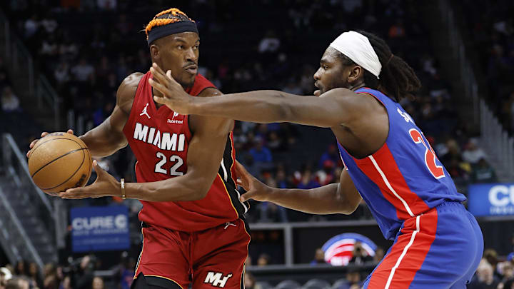 Dec 16, 2024; Detroit, Michigan, USA;  Miami Heat forward Jimmy Butler (22) is defended by Detroit Pistons center Isaiah Stewart (28) in the first half at Little Caesars Arena. Mandatory Credit: Rick Osentoski-Imagn Images