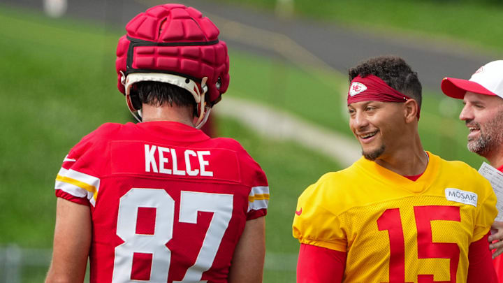 Jul 22, 2025; St. Joseph, MO, USA; Kansas City Chiefs quarterback Patrick Mahomes (15) laughs with tight end Travis Kelce (87) during training camp at Missouri Western State University. Mandatory Credit: Denny Medley-Imagn Images