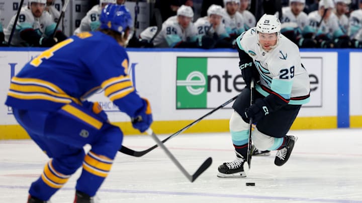 Jan 11, 2025; Buffalo, New York, USA;  Seattle Kraken defenseman Vince Dunn (29) carriers the puck up ice during the third period against the Buffalo Sabres at KeyBank Center. Mandatory Credit: Timothy T. Ludwig-Imagn Images