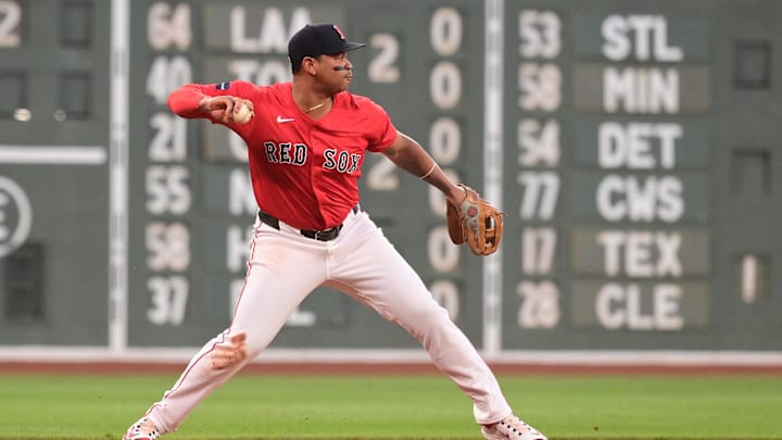 Aug 23, 2024; Boston, Massachusetts, USA; Boston Red Sox third baseman Rafael Devers (11) makes a throw for an out to end the first inning against the Arizona Diamondbacks at Fenway Park. Mandatory Credit: Eric Canha-Imagn Images