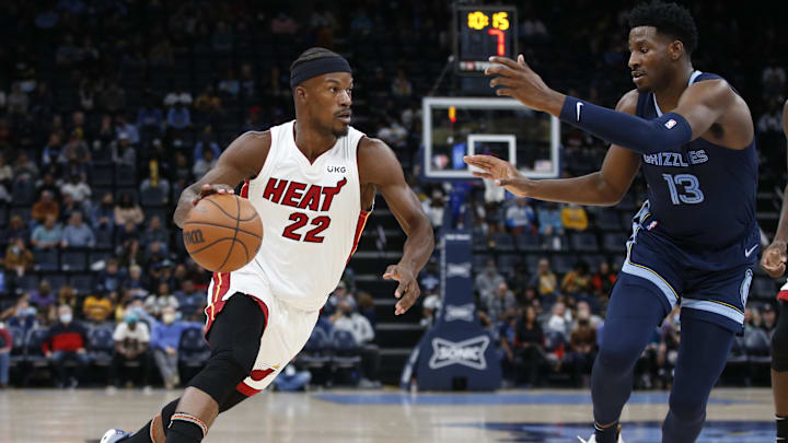 Oct 30, 2021; Memphis, Tennessee, USA; Miami Heat forward Jimmy Butler (22) drives against Memphis Grizzlies forward Jaren Jackson Jr. (13) in the first quarter at FedExForum. Mandatory Credit: Tim Heitman-Imagn Images