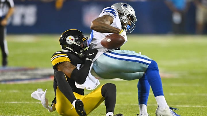 Aug 5, 2021; Canton, Ohio, USA; Pittsburgh Steelers cornerback Mark Gilbert (17) tackles Dallas Cowboys wide receiver Brandon Smith (80) during the second half at Tom Benson Hall of Fame Stadium. Mandatory Credit: Ken Blaze-Imagn Images