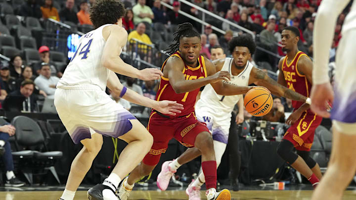Mar 13, 2024; Las Vegas, NV, USA; USC Trojans guard Isaiah Collier (1) dribbles between Washington