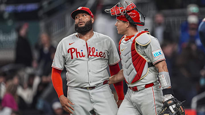 Apr 9, 2025; Cumberland, Georgia, USA; Philadelphia Phillies pitcher José Alvarado (46) reacts with catcher J.T. Realmuto (10) after the Phillies defeated the Atlanta Braves at Truist Park.