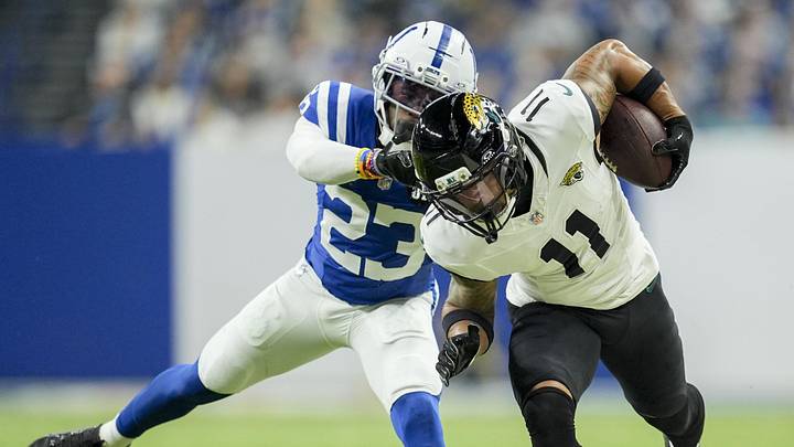 Dec 28, 2025; Indianapolis, Indiana, USA; Indianapolis Colts cornerback Kenny Moore II (23) shoves Jacksonville Jaguars wide receiver Parker Washington (11) out of bounds at Lucas Oil Stadium. Mandatory Credit: Mykal McEldowney-USA TODAY Network via Imagn Images