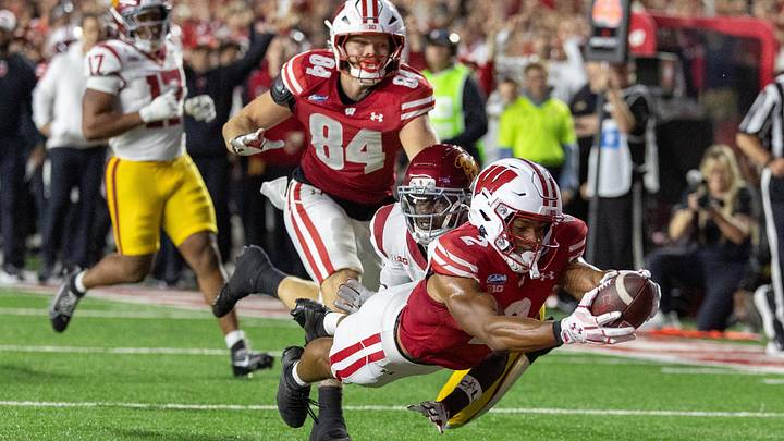 Oct 24, 2026; Madison, Wisconsin, USA;  Wisconsin Badgers wide receiver Chris Brooks Jr. (2) dives across the goal line for a touchdown against the USC Trojans during the second half at Camp Randall Stadium.  Mandatory Credit: Anthony Wahl-Imagn Images