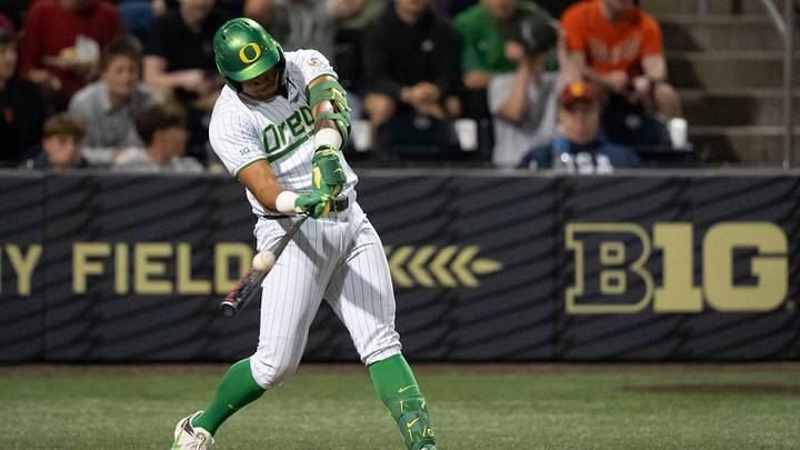 Oregon infielder Naulivou Lauaki Jr. hits a home run to tie the game in the ninth inning as the Oregon Ducks host the USC Trojans on May 14, 2026, in Eugene, Oregon.