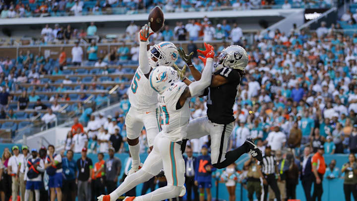 Miami Dolphins cornerback Jalen Ramsey (5) intercepts a pass intended to Las Vegas Raiders wide receiver Tre Tucker (11) during the fourth quarter at Hard Rock Stadium.
