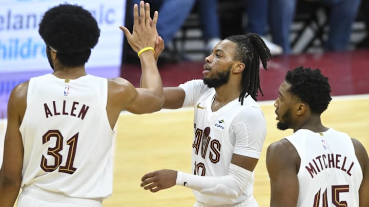 Nov 26, 2023; Cleveland, Ohio, USA; Cleveland Cavaliers center Jarrett Allen (31), guard Darius Garland (10), and guard Donovan Mitchell (45) celebrate in the fourth quarter against the Toronto Raptors at Rocket Mortgage FieldHouse. Mandatory Credit: David Richard-Imagn Images