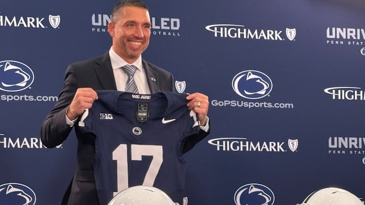 Penn State Nittany Lions football coach Matt Campbell poses with a jersey during his introductory press conference in State College. Penn State Nittany Lions football coach Matt Campbell poses with a jersey during his introductory press conference in State College.