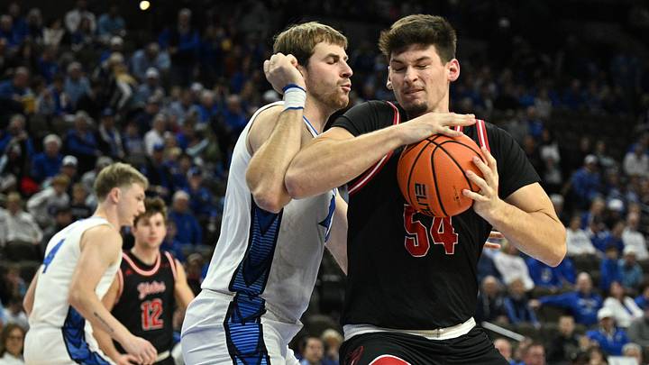 Nov 5, 2025; Omaha, Nebraska, USA; South Dakota Coyotes center Cameron Fens (54) drives against Creighton Bluejays forward Isaac Traudt (41) during the first half at CHI Health Center Omaha. Mandatory Credit: Steven Branscombe-Imagn Images Nov 5, 2025; Omaha, Nebraska, USA; South Dakota Coyotes center Cameron Fens (54) drives against Creighton Bluejays forward Isaac Traudt (41) during the first half at CHI Health Center Omaha. Mandatory Credit: Steven Branscombe-Imagn Images